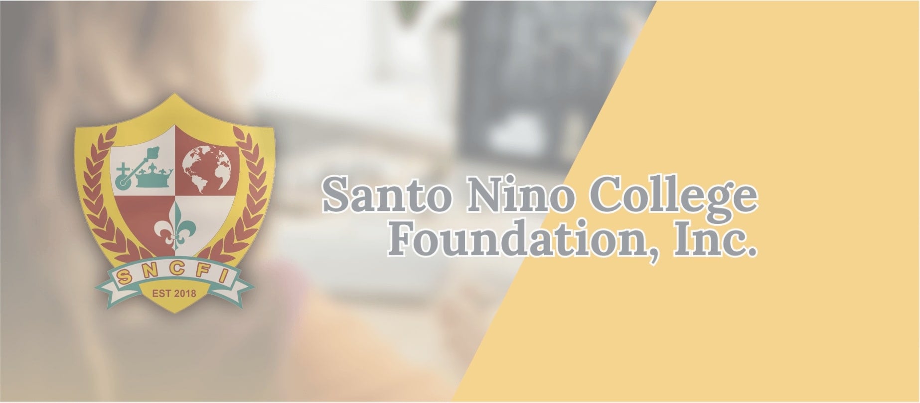 The SNCFI crest beside the school's name