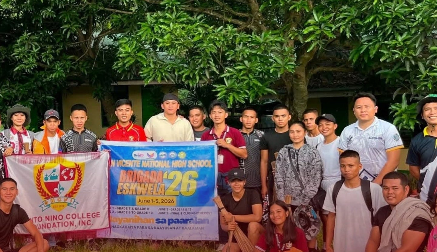 SNCFI volunteers with the school banner at Brigada Eskwela 2026